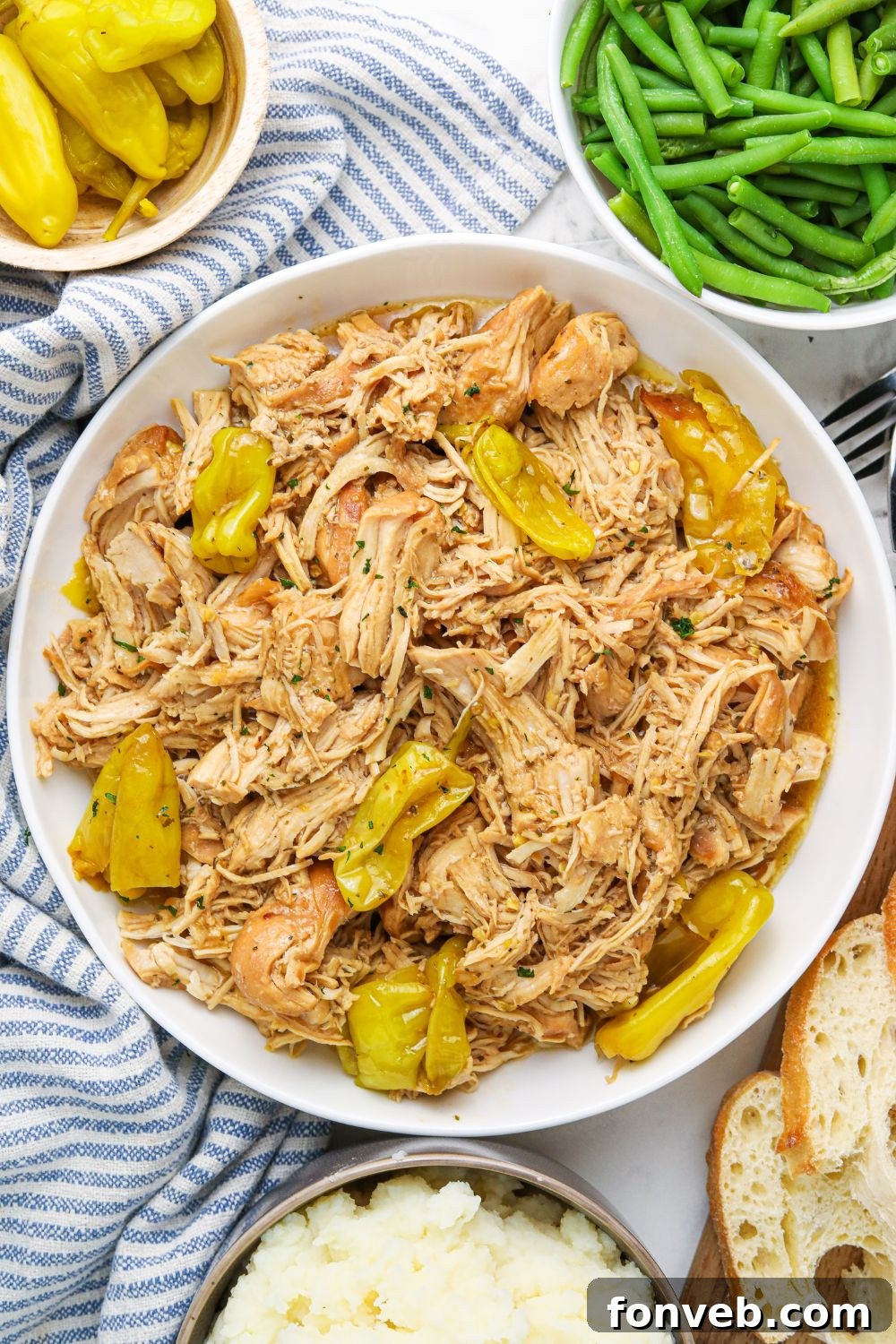 mississippi chicken and sides on table in bowls 