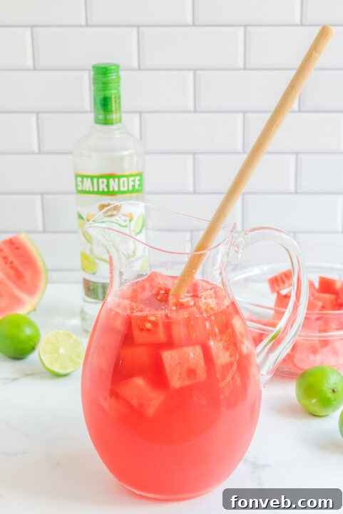 Garnishing Watermelon Cocktail with lime.