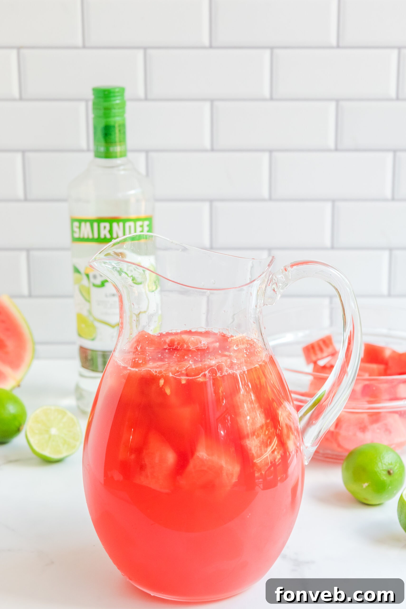Front view of a glass pitcher full of Watermelon Cocktail.