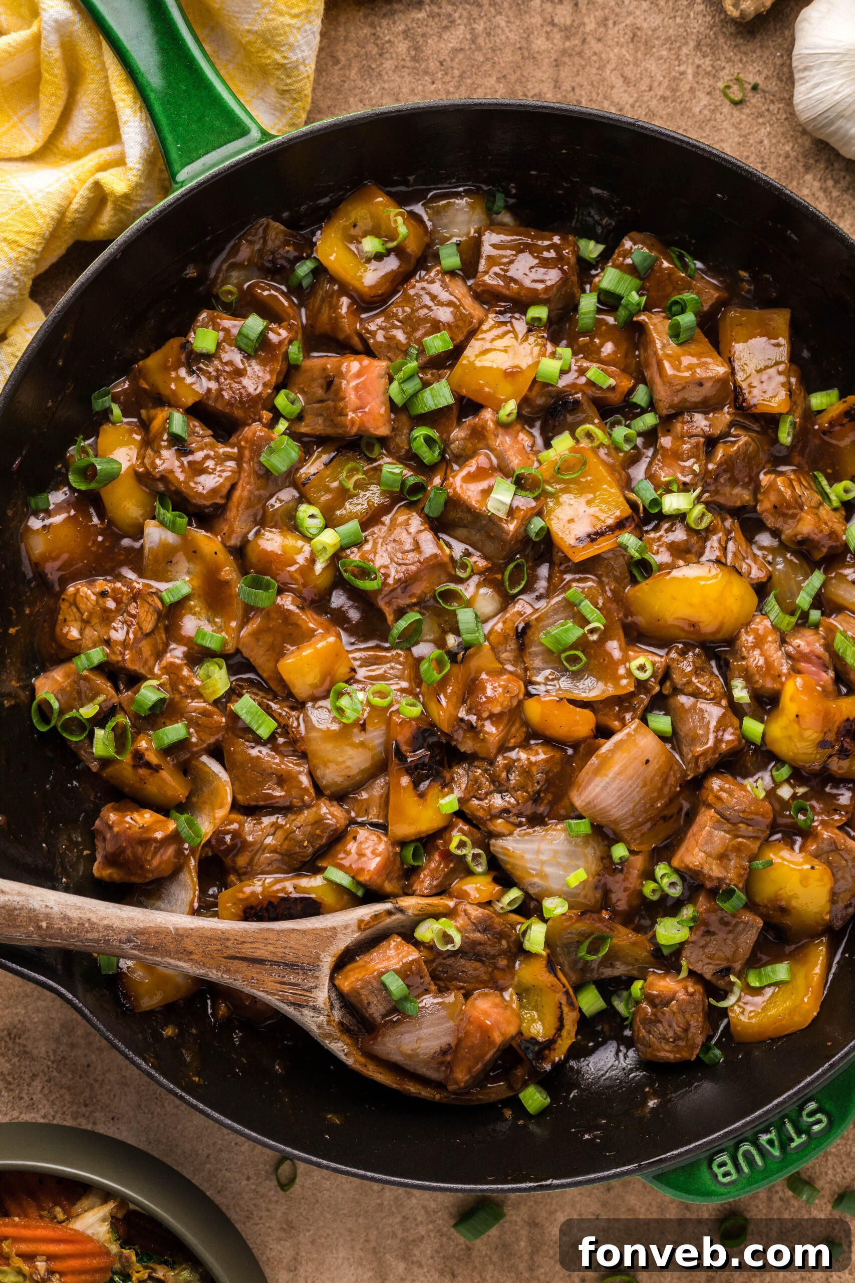 Overhead view of Teriyaki Steak Bites in a cast iron skillet.