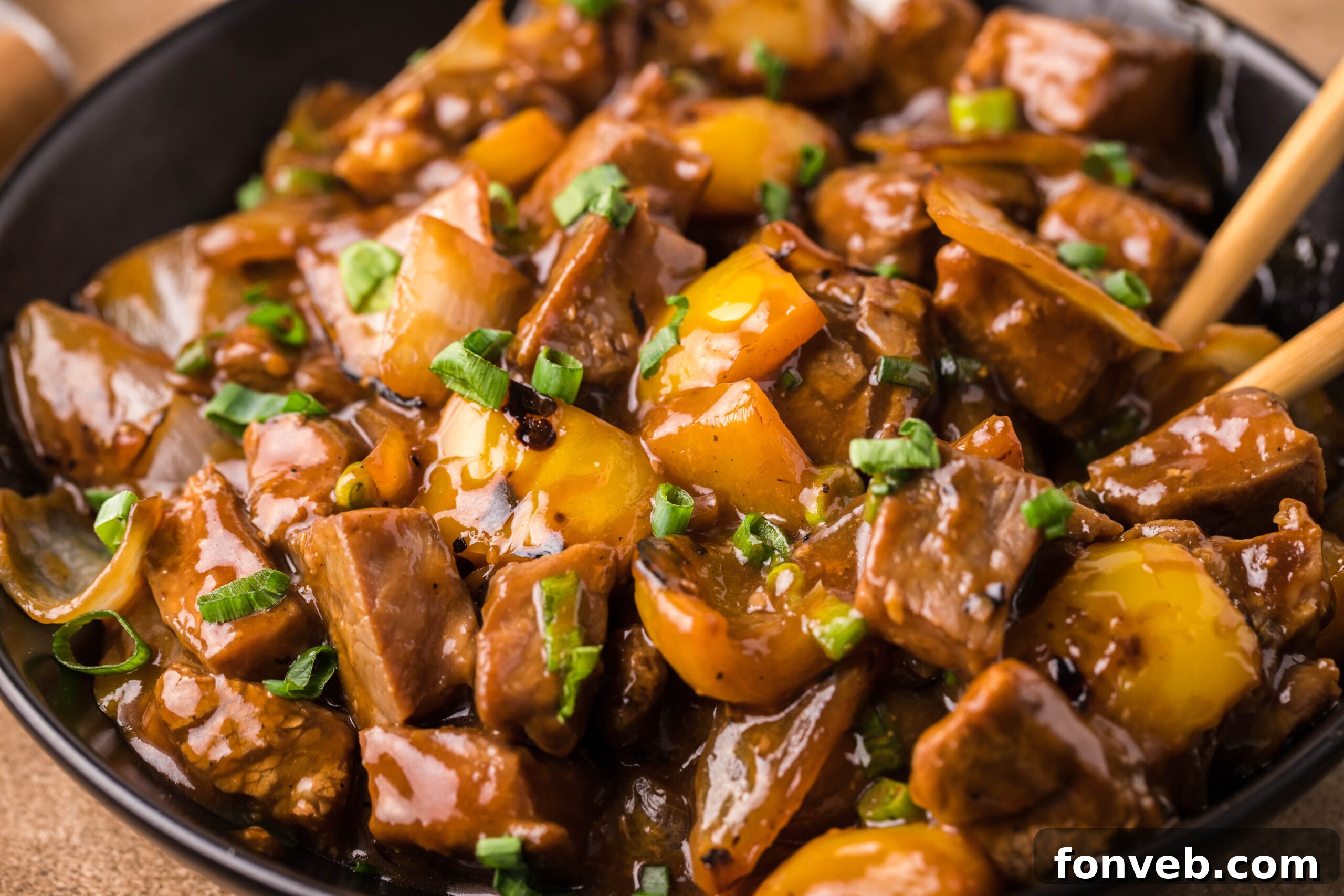 Close up view of Teriyaki Steak Bites in a black dish 