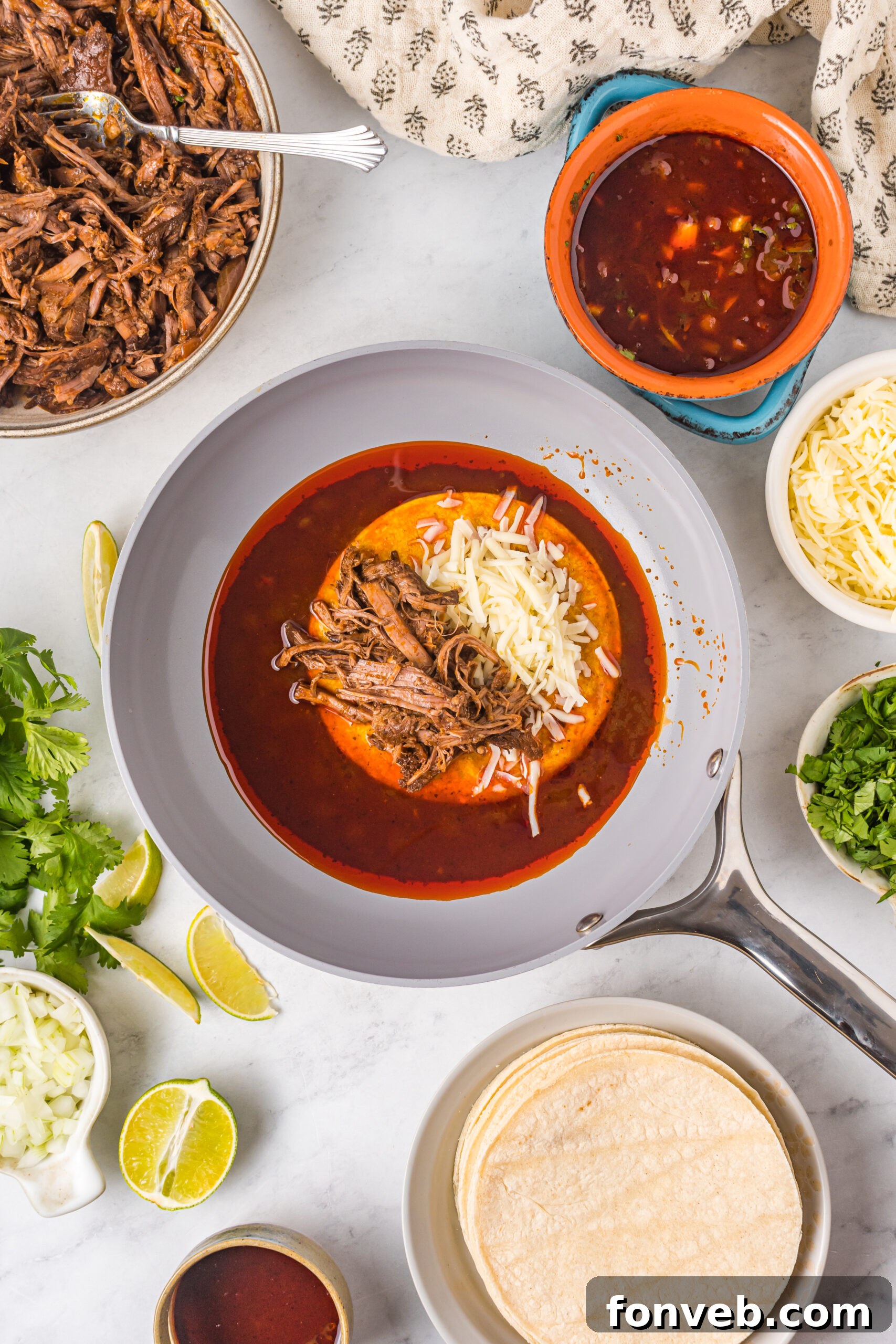 Overhead view of Birria Tacos being made.