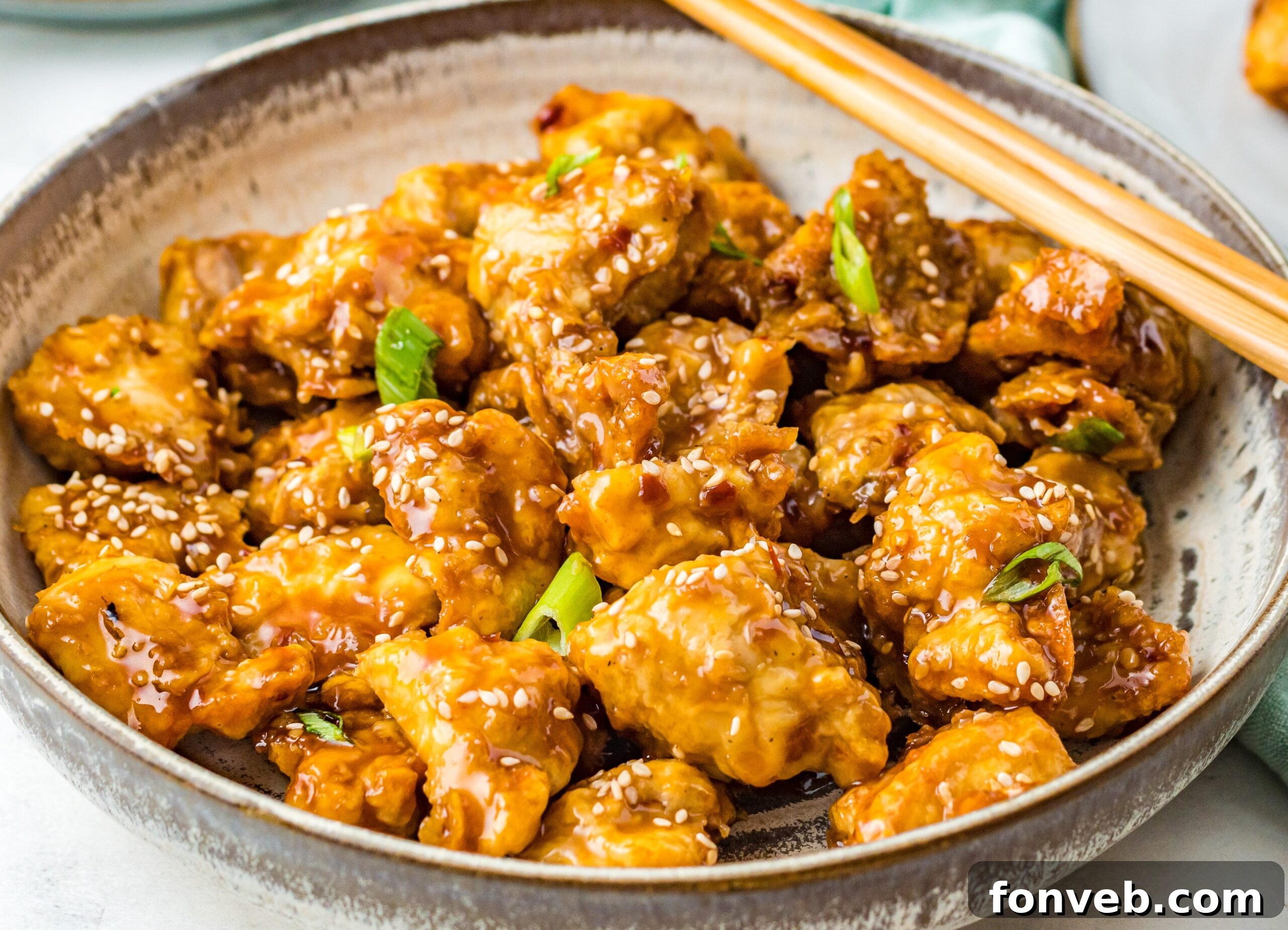 Close up view of Air Fryer General Tsos Chicken in a gray dish.