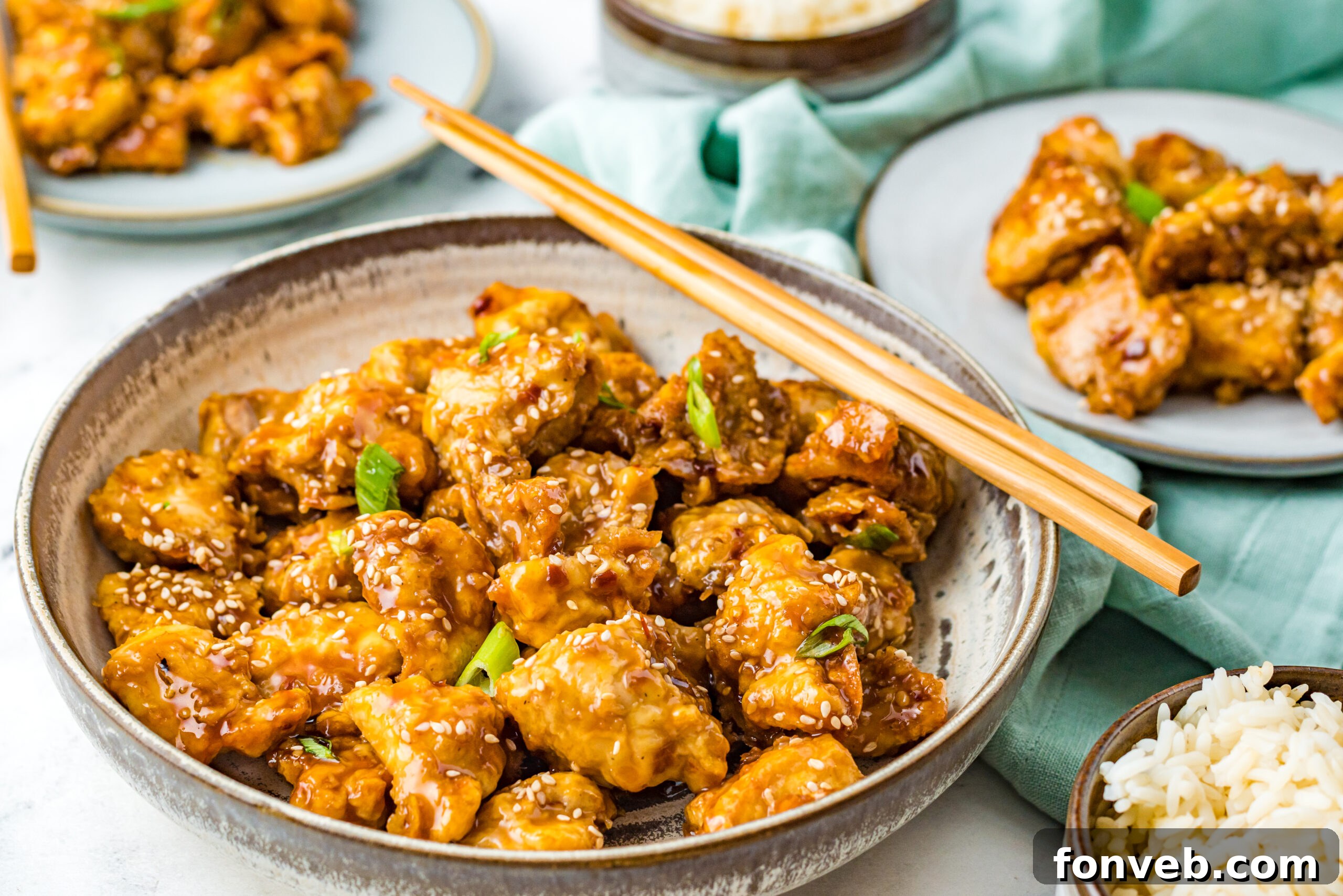 Front up view of Air Fryer General Tsos Chicken in a gray dish.