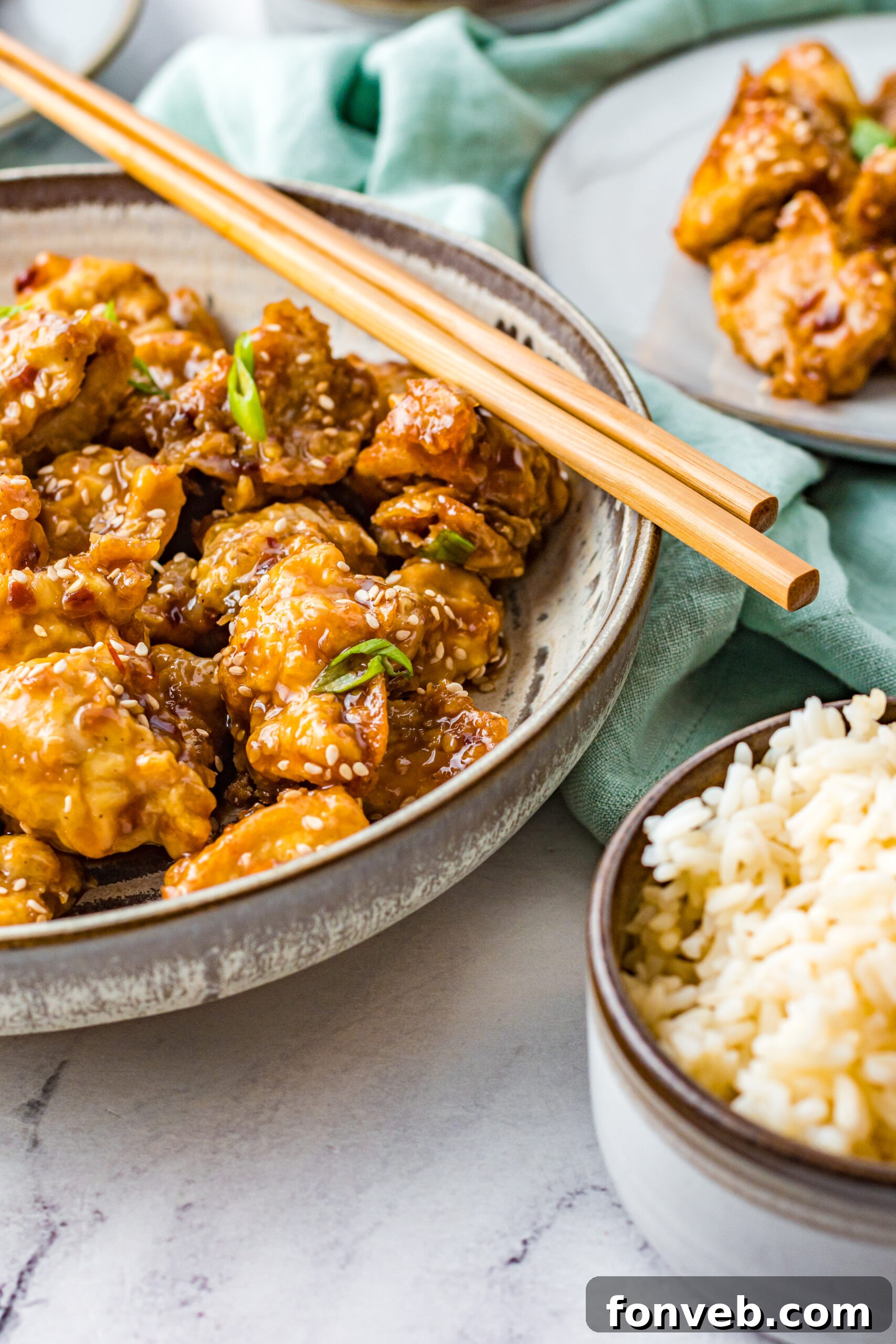 Close up view of Air Fryer General Tsos Chicken in a gray dish.