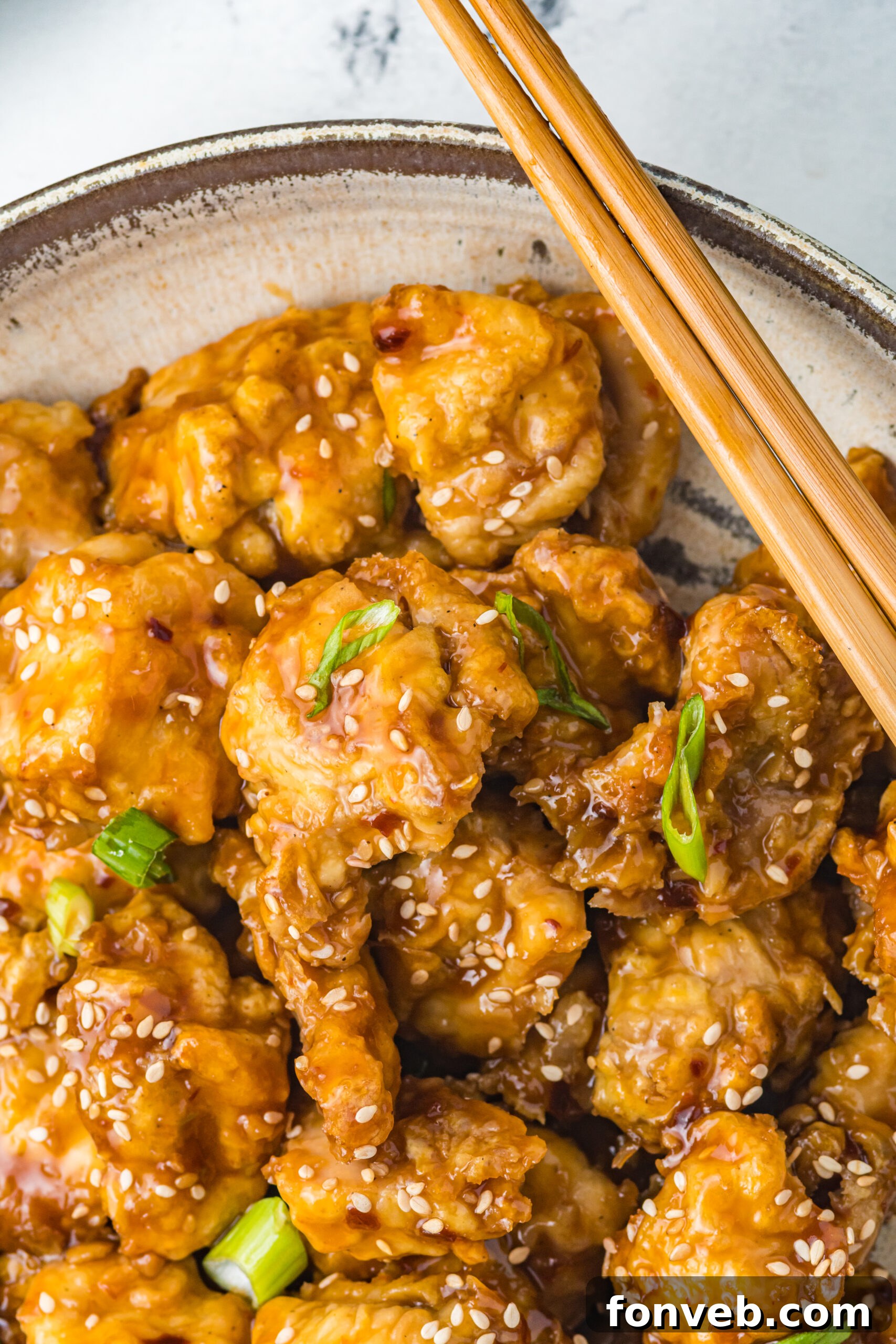 Close up view of Air Fryer General Tsos Chicken in a gray dish.