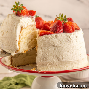 Strawberry Angel Food Cake with whipped cream and berries
