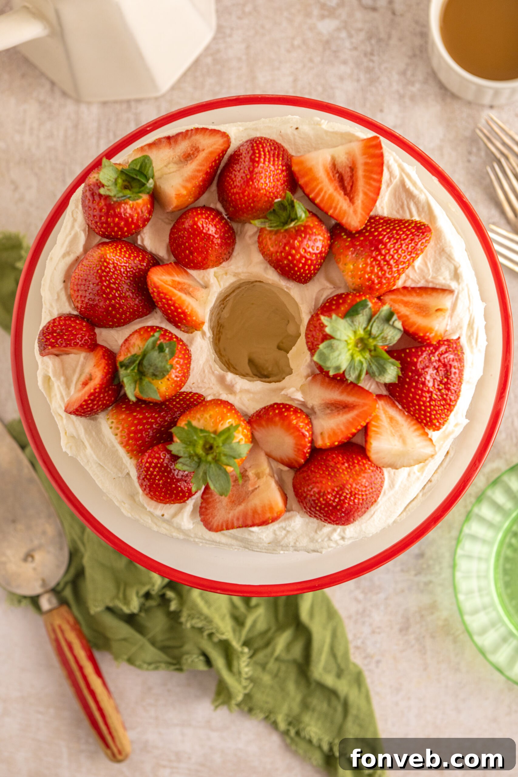 overhead view of the Strawberry Angel Food Cake topped with fresh strawberries. 