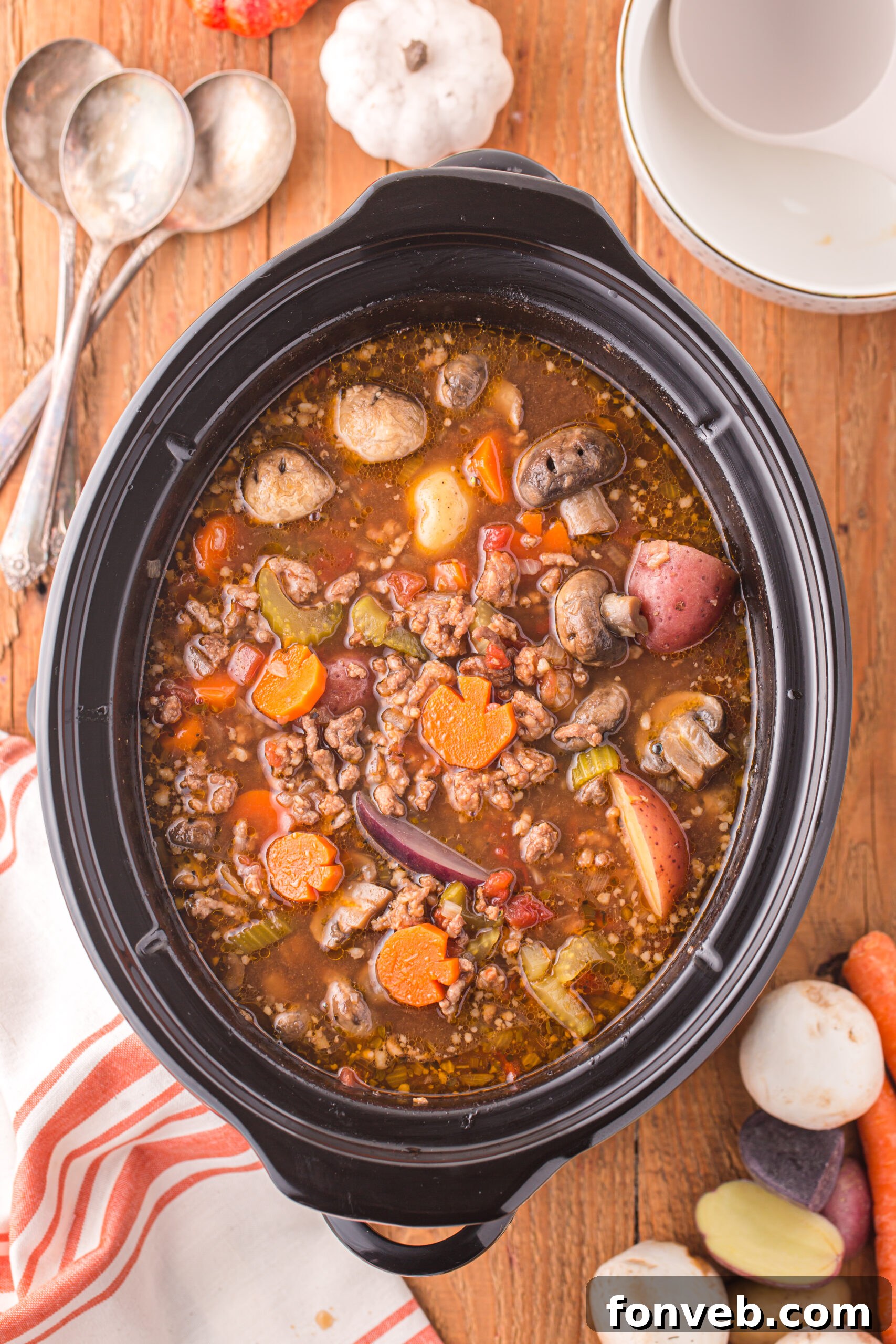 Overhead view of Witches Brew Stew in a slow cooker, showcasing the rich colors and textures.