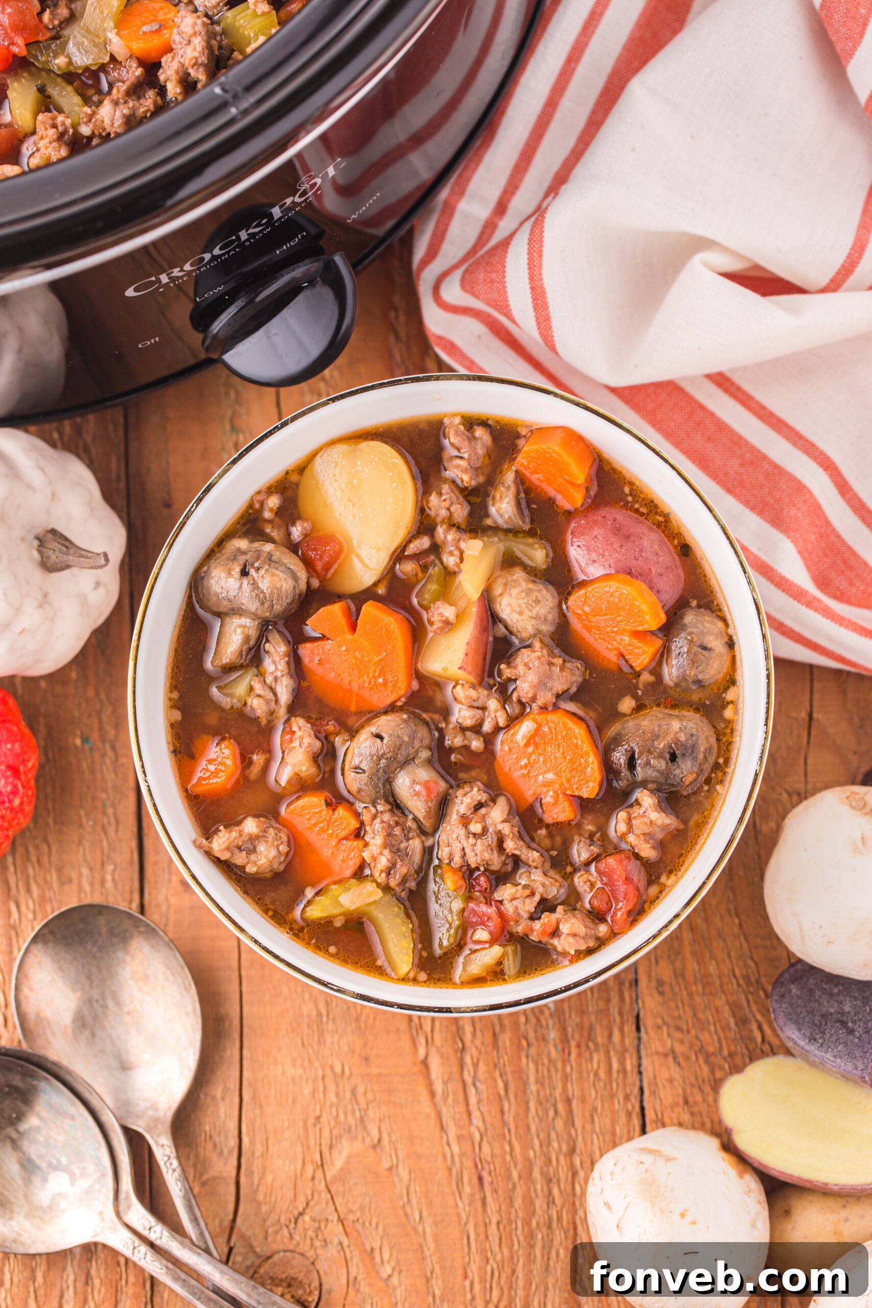 Overhead view of a serving of Witches Brew Stew in a bowl, garnished with fresh herbs.