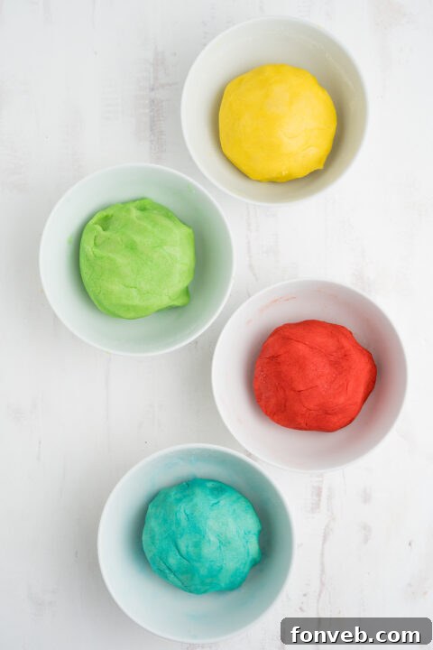 Vibrant Jello Bites 9 Step-by-step image of dividing cookie dough into portions for different Jello flavors.