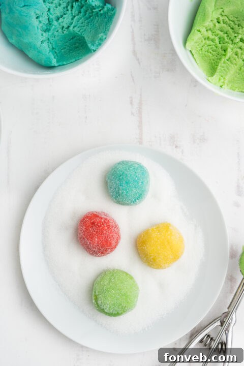 Vibrant Jello Bites 10 Step-by-step image of mixing Jello powder into cookie dough, showing vibrant colors.