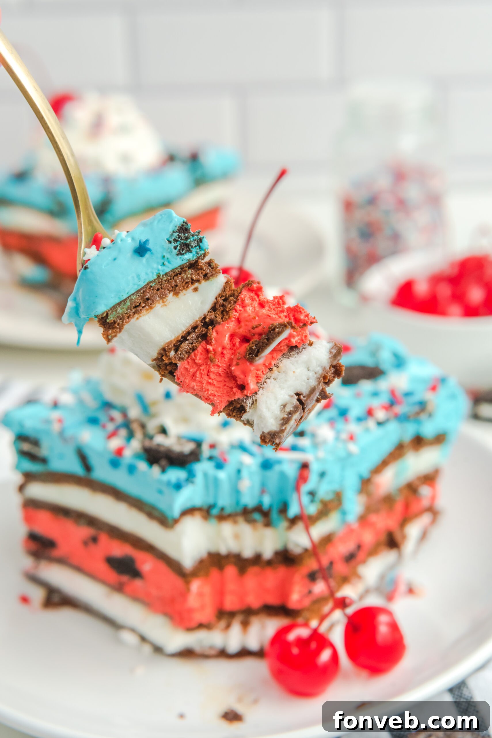 Close up view of a bite of Patriotic Ice Cream Sandwich Cake.