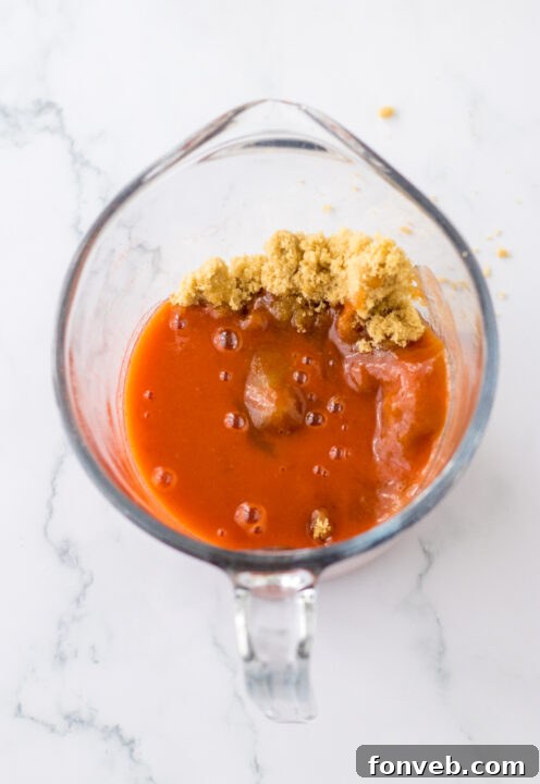Diced chicken coated in cornstarch, ready for browning.