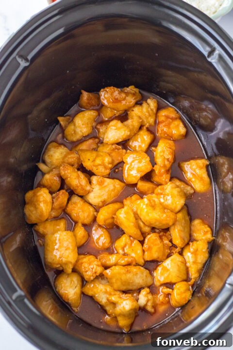 Mixing bowl with hot wing sauce, brown sugar, water, and apple cider vinegar.