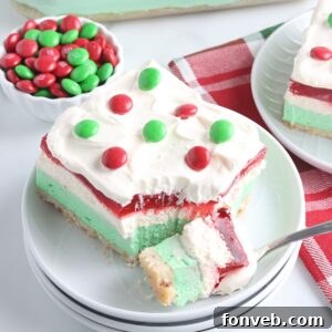 Christmas Lasagna sliced on plate with a bite full on fork