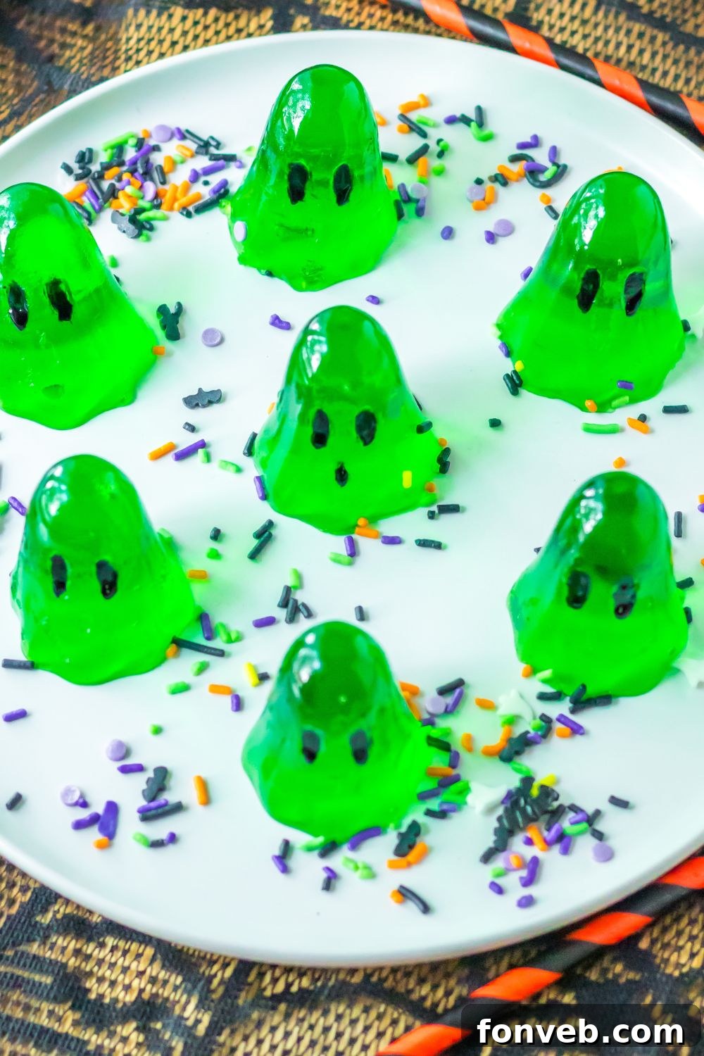 Spooky Spirit Shooters 12 A festive plate showcasing a variety of colorful jello shots, perfect for a lively party spread.