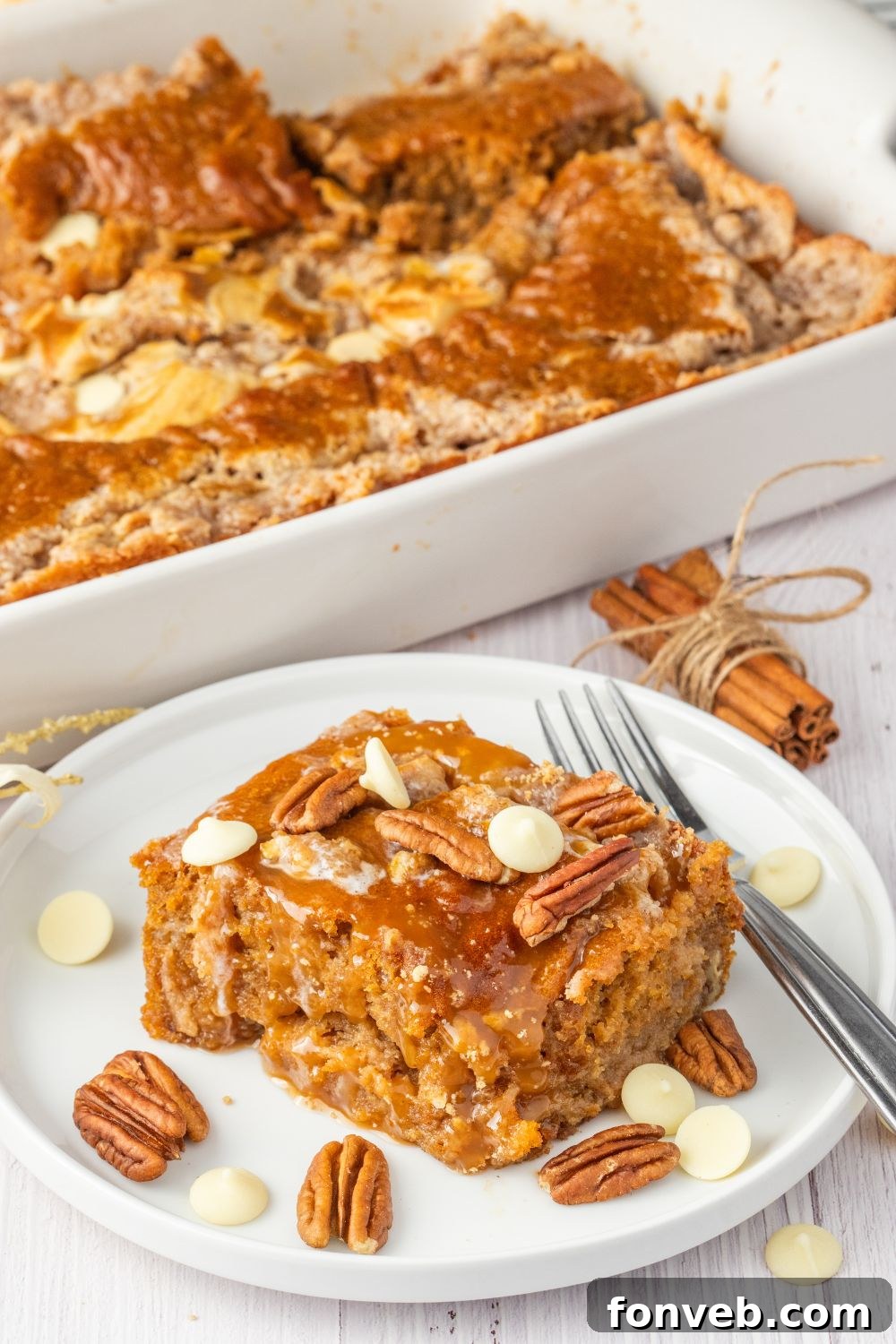 pumpkin cake on plate with nuts around it