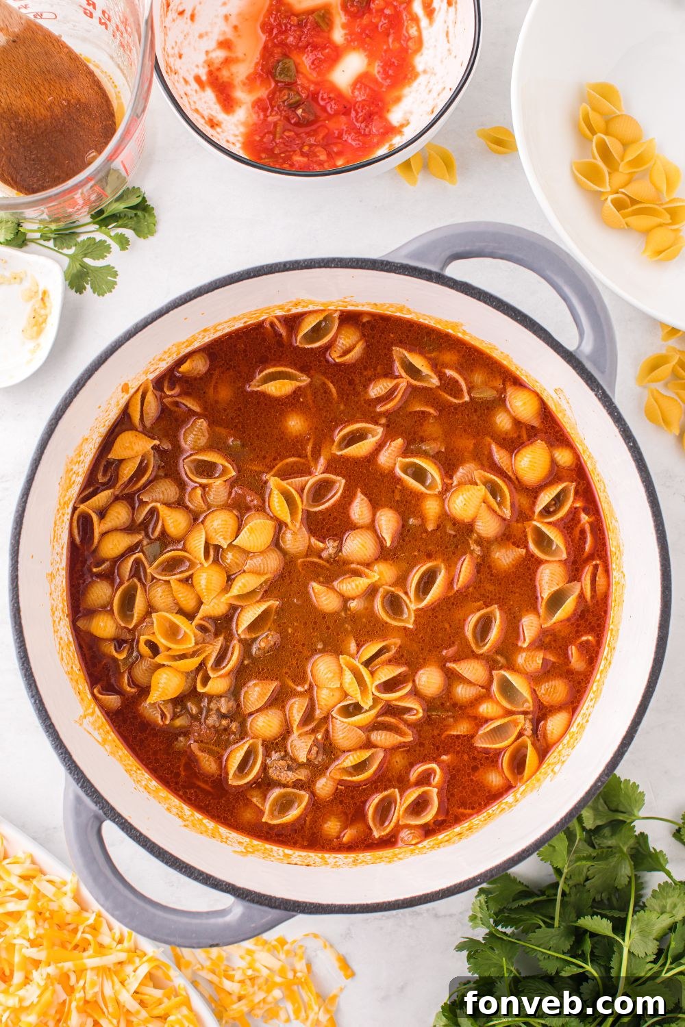 uncooked shells in a taco pasta dish 