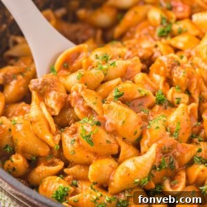 taco pasta in a pan with a wooden spoon