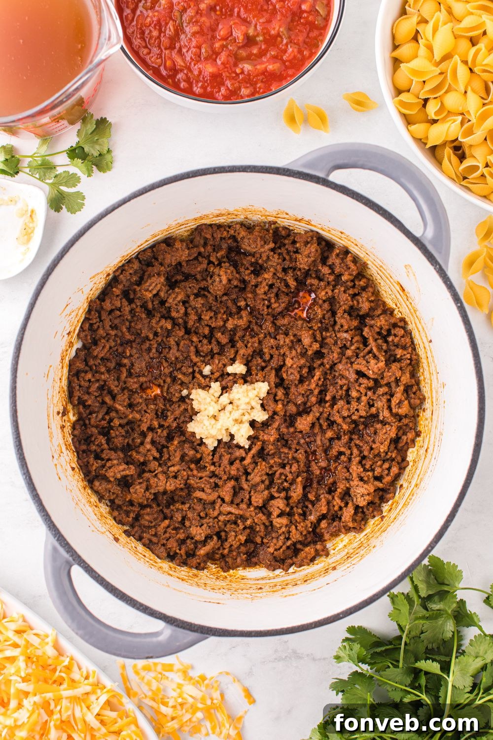cooked ground beef with seasoning in pot