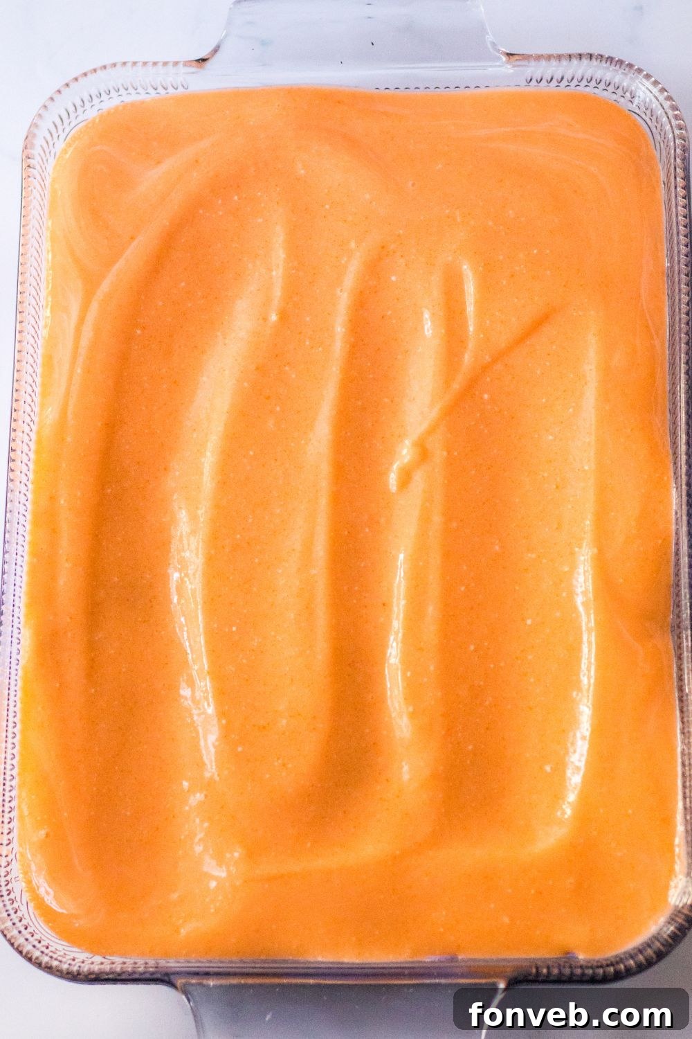 orange layer of jello mixture on bars 