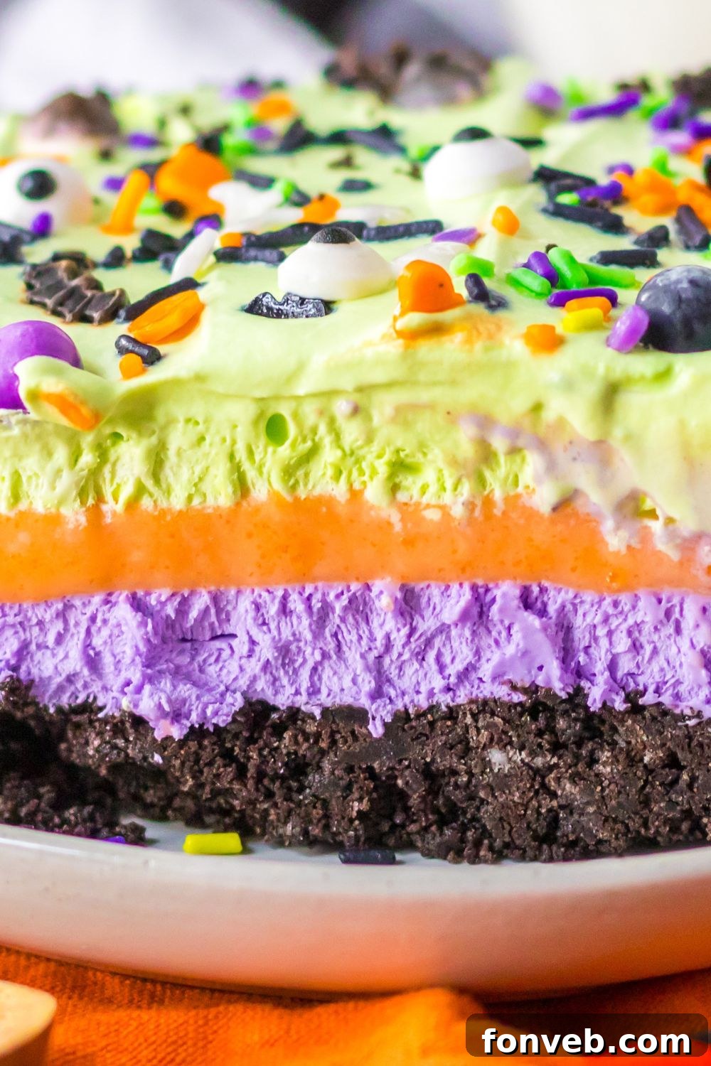 close up of a layered Halloween lush dessert bar on a plate