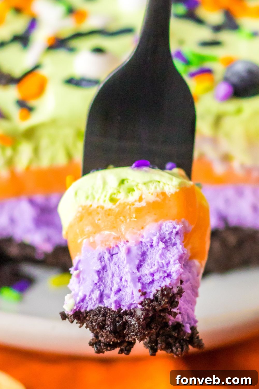 fork with lush layered dessert on it