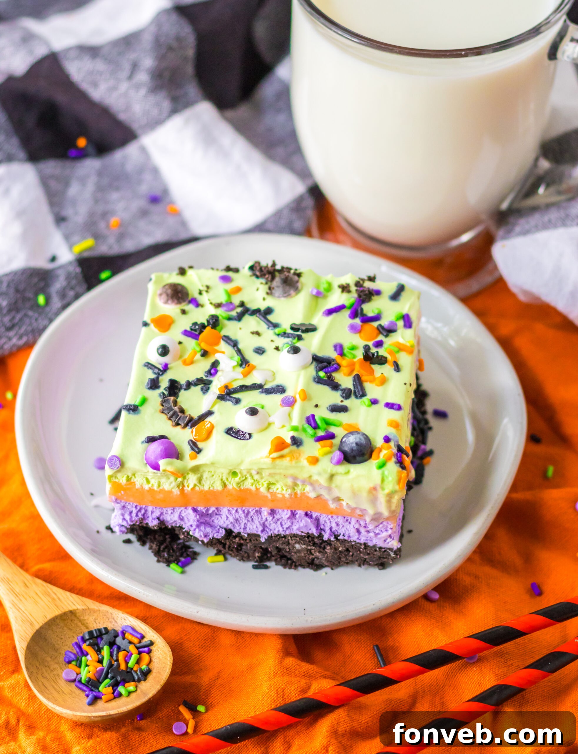 Halloween Lush on a white plate topped with candy eyeballs and halloween colored sprinkles 
