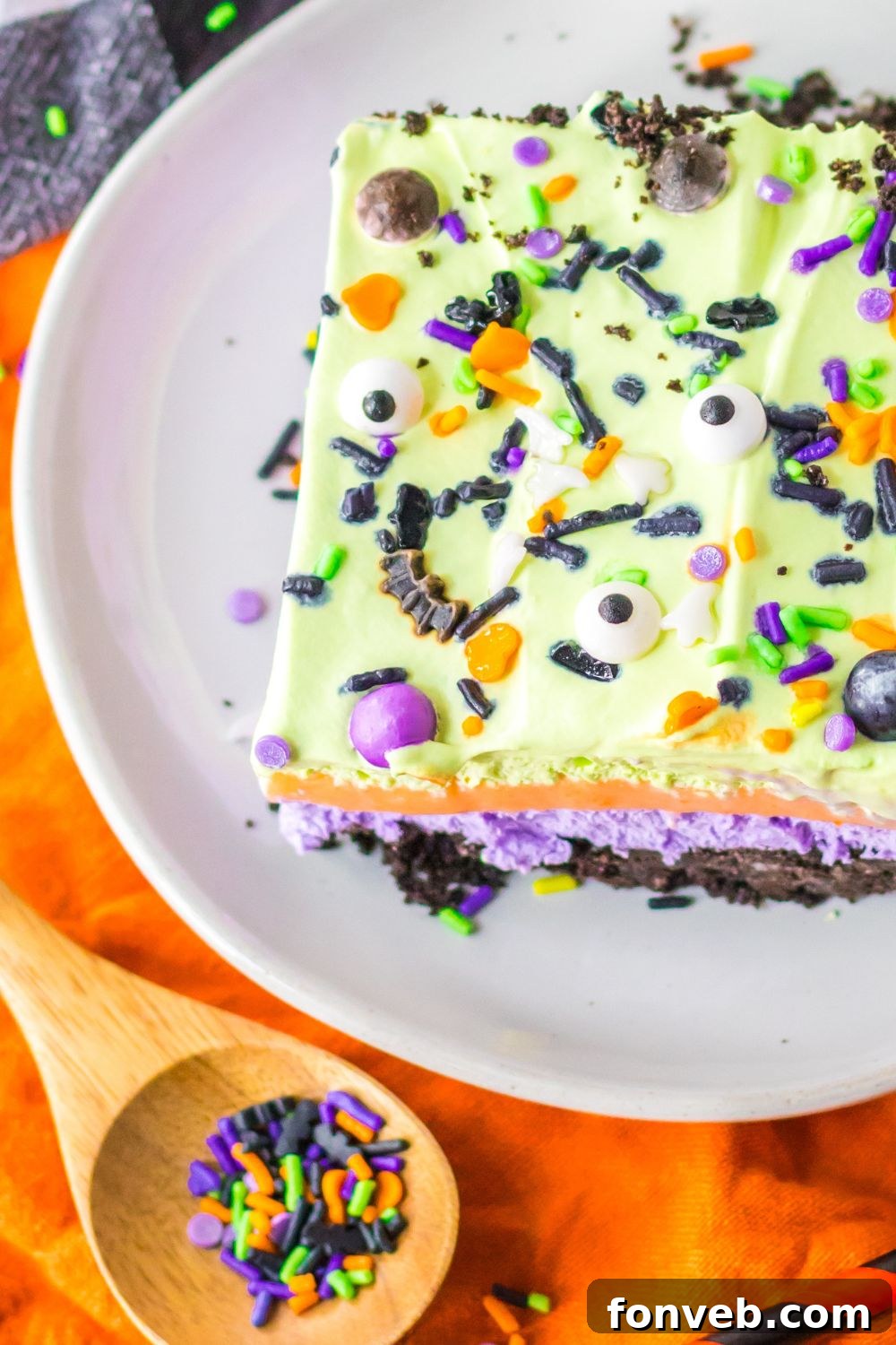 side of plate with a lush dessert sliced on it