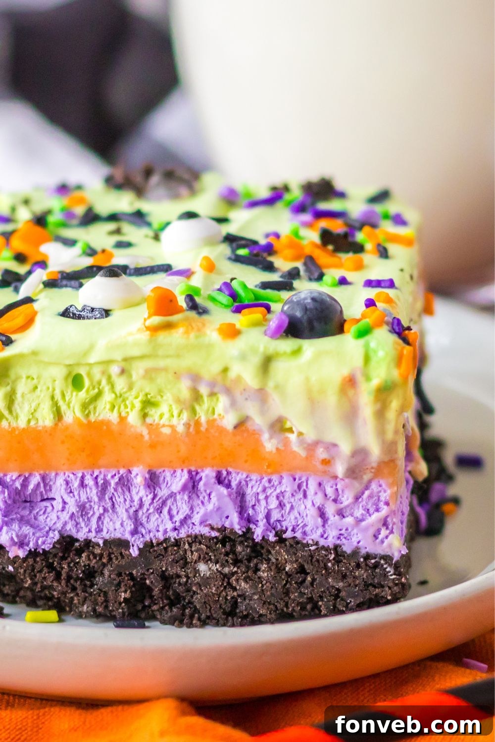 side of dessert on plate to see layers in the Halloween lush dessert
