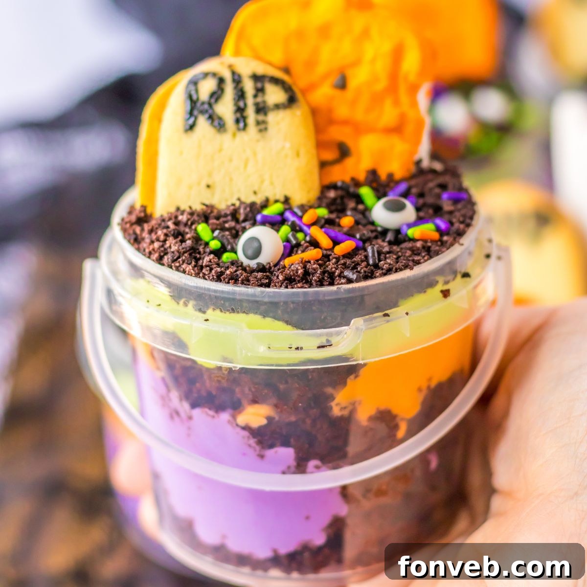 Monster Mash Pudding Treats 2 Halloween Pudding Cup in hand