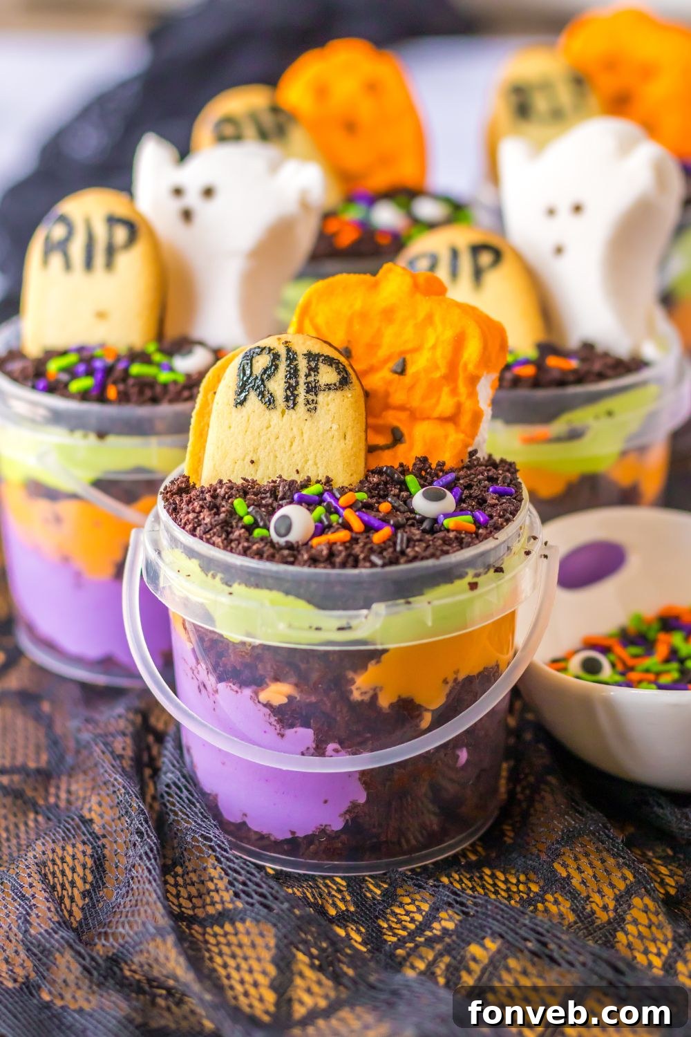Monster Mash Pudding Treats 13 halloween jello and cake cups on talbe