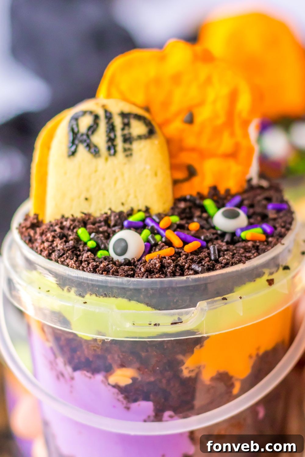 Monster Mash Pudding Treats 16 view of halloween pudding cup in hand close up view