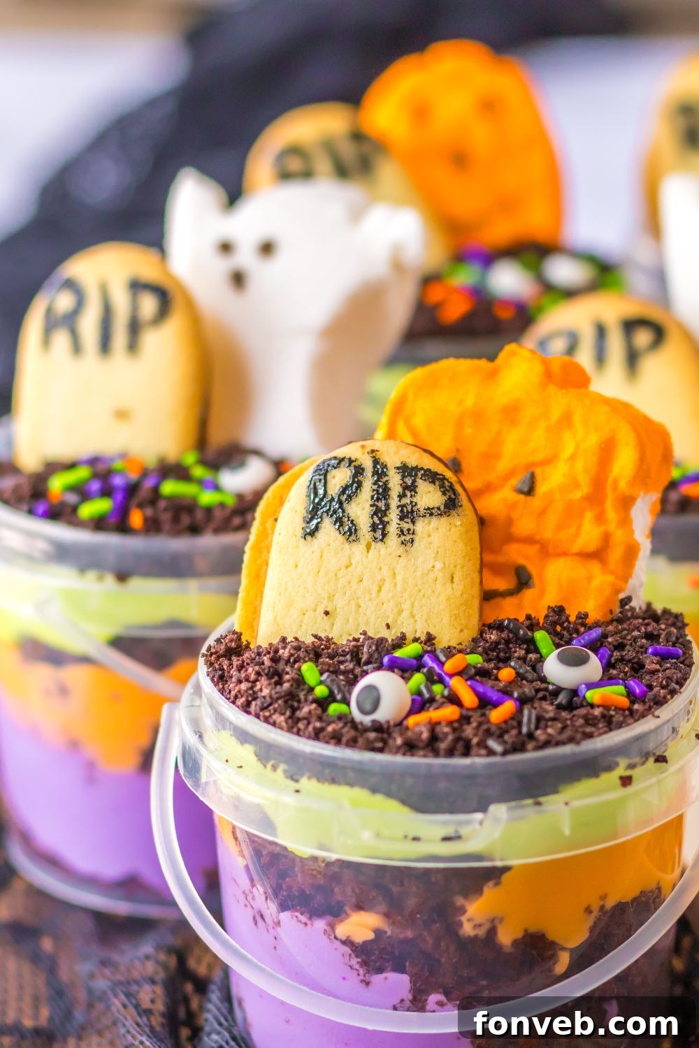 Monster Mash Pudding Treats 17 halloween buckets on table with candies decorated