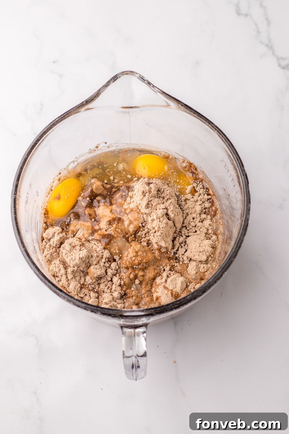 Monster Mash Pudding Treats 5 chocolate cake mix with ingredients in a measuring cup on table