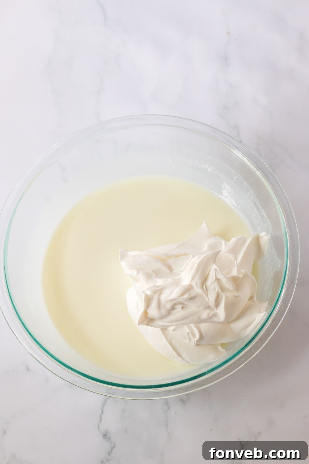 Monster Mash Pudding Treats 7 jello and whipped cream in a glass bowl