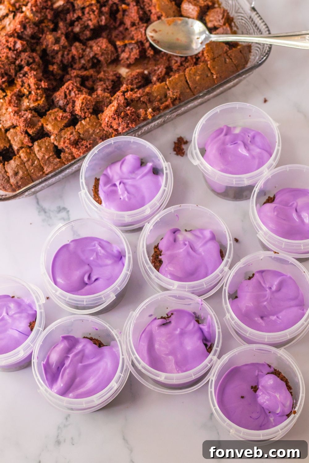 Monster Mash Pudding Treats 8 purple pudding in plastic containers on table