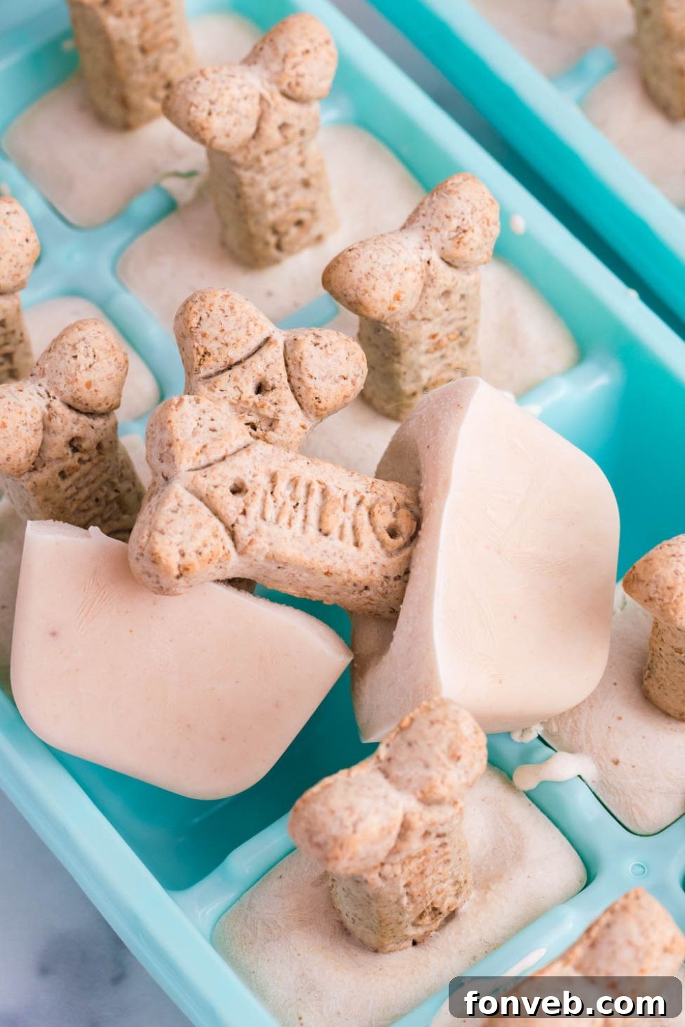 ice cream in a ice cube tray with cookie on it