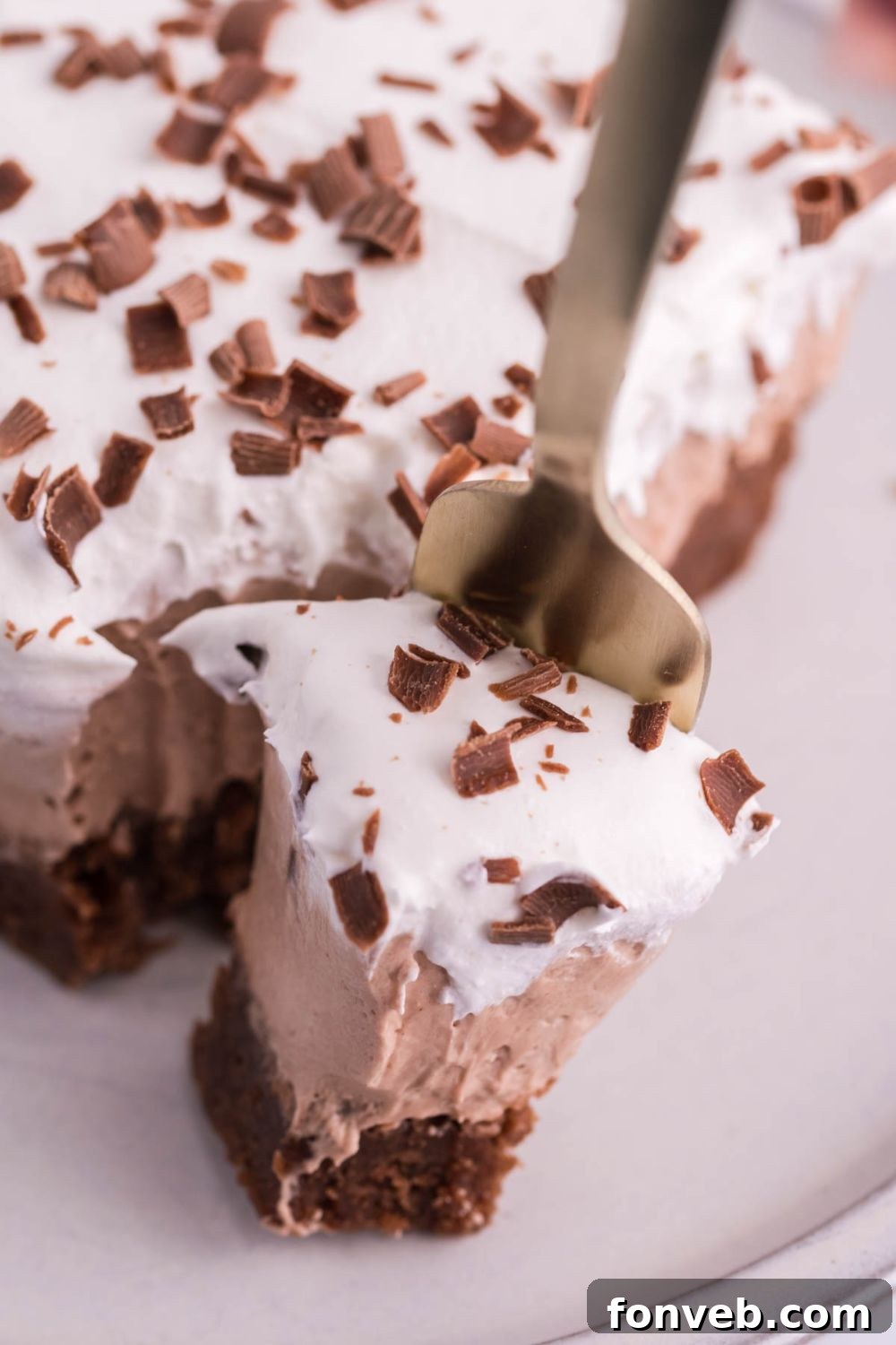 fork with a bite of French silk brownie on it