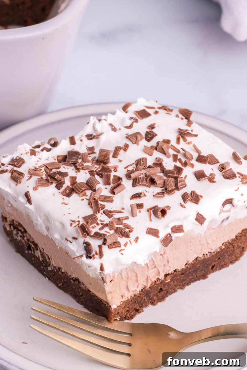 slice of French silk brownies on table with a fork in front