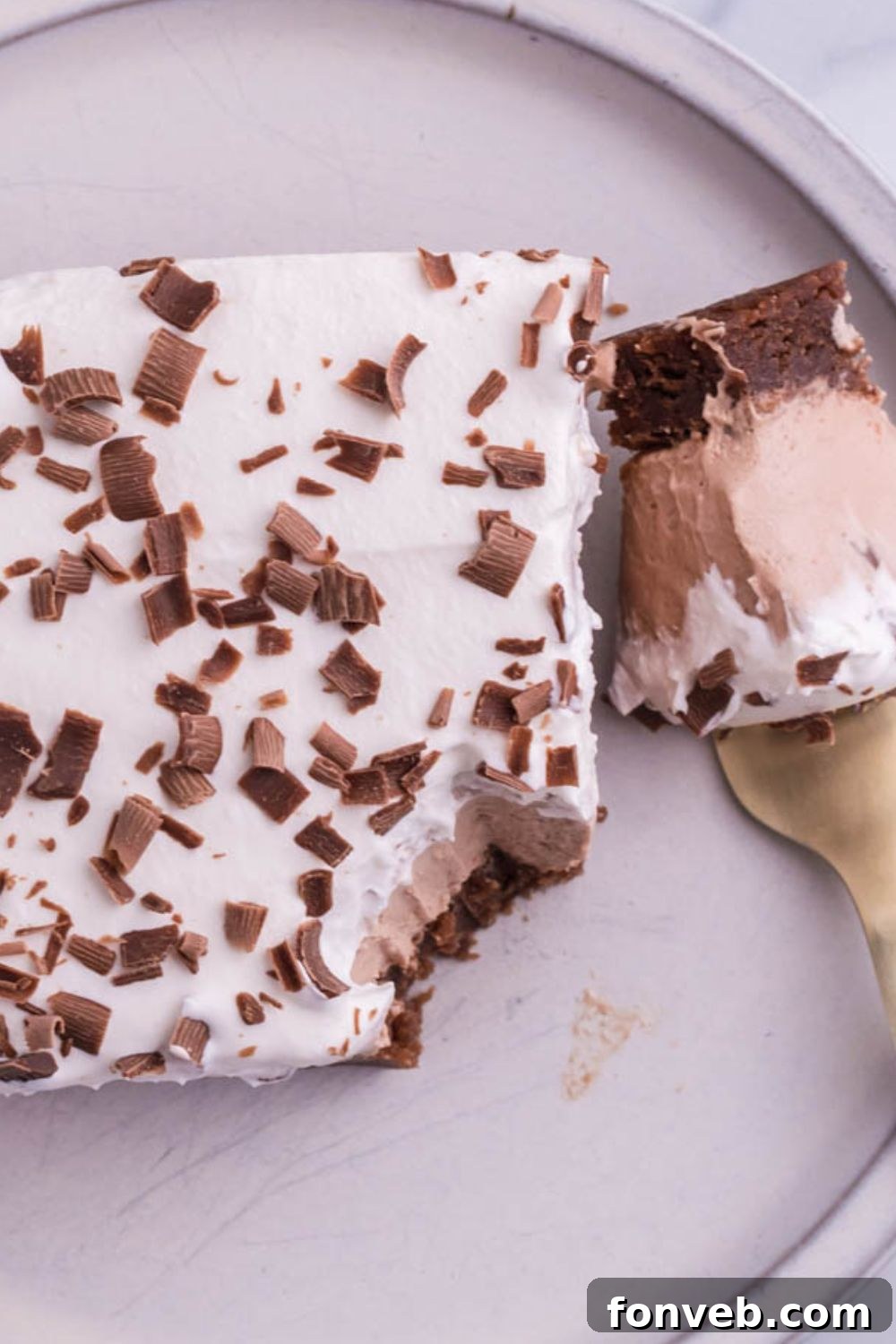 brownie on plate with bite taken out of it