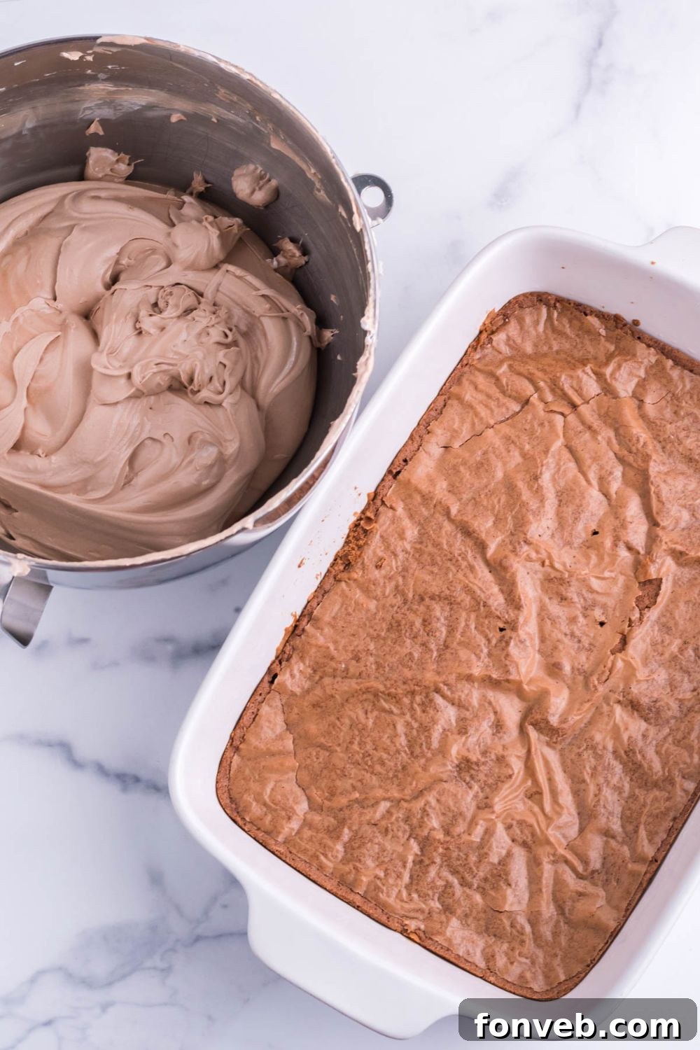 brownies baked in pan with french silk pie mixturein a bowl on the side 