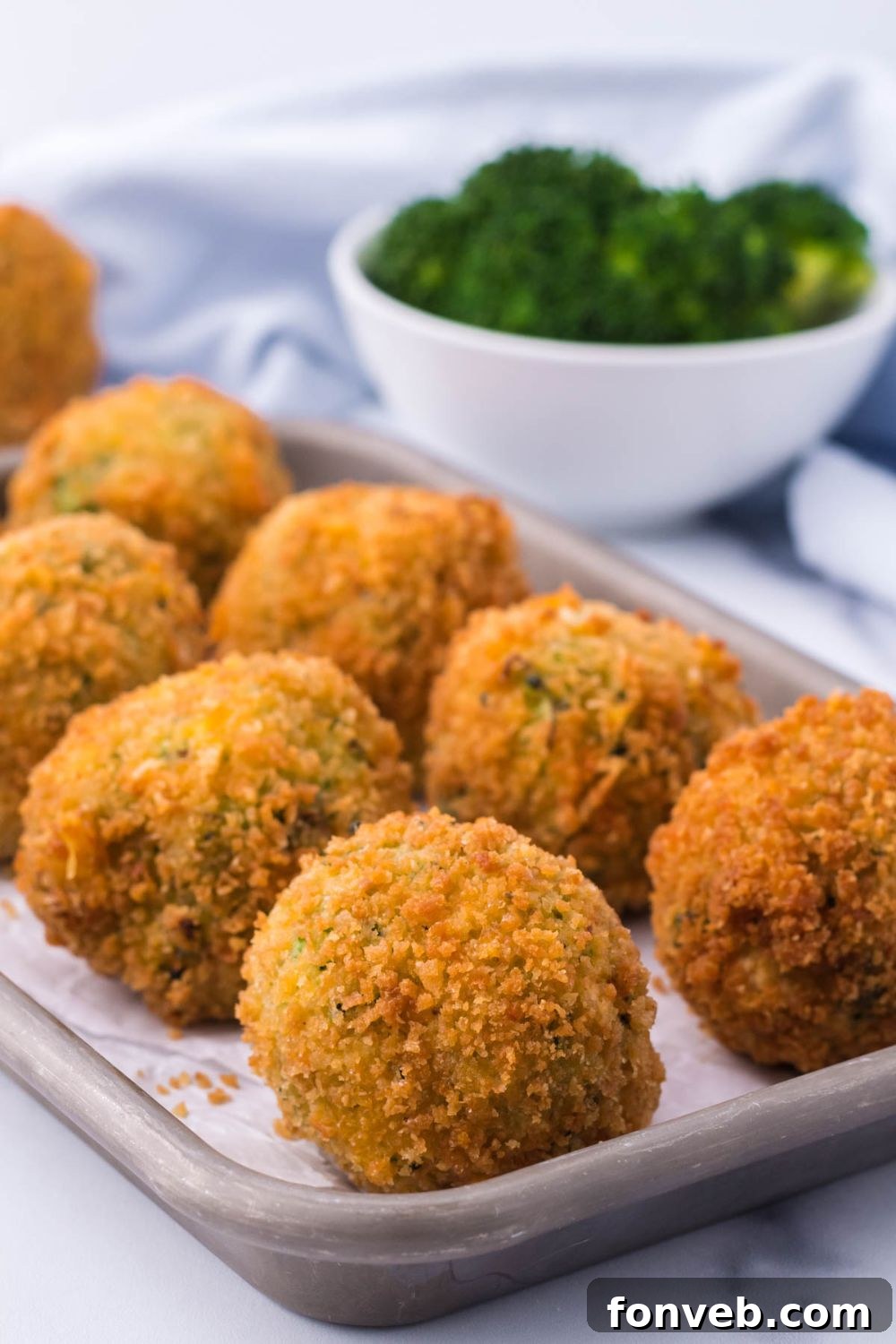 Crispy Fried Broccoli Poppers 5 Fried Broccoli Bites sitting in rows on a glass platter