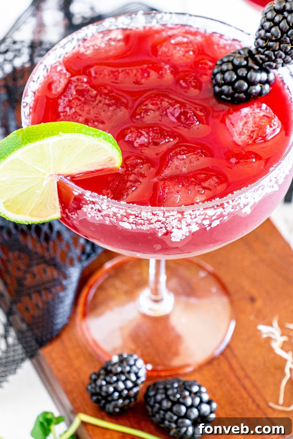 Magic Potion Margarita 12 Close-up view of a Sanderson Sisters Margarita, showcasing its rich color, ice, and garnish.