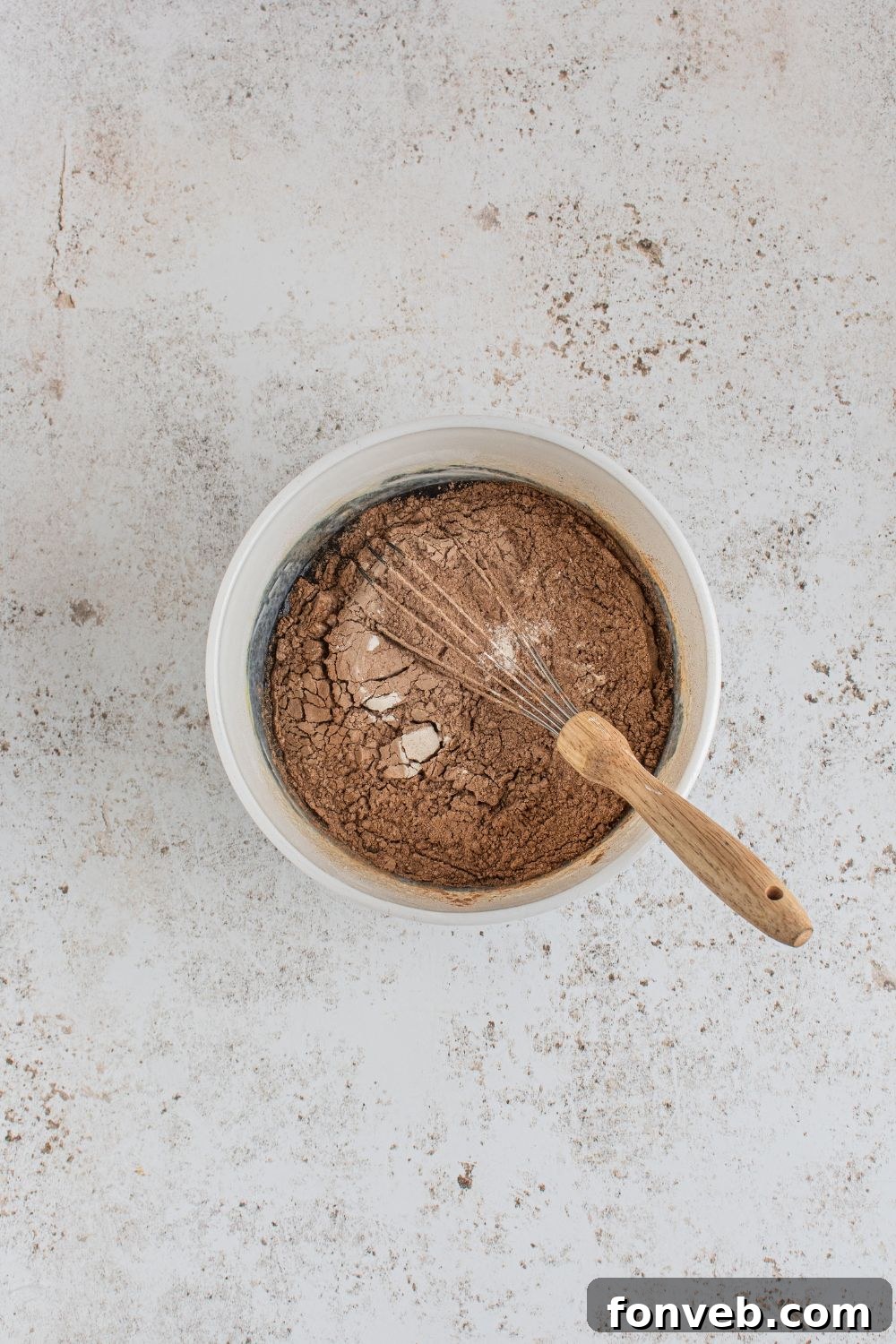 Chocolate dry cupcake batter in a bowl, before wet ingredients are added.