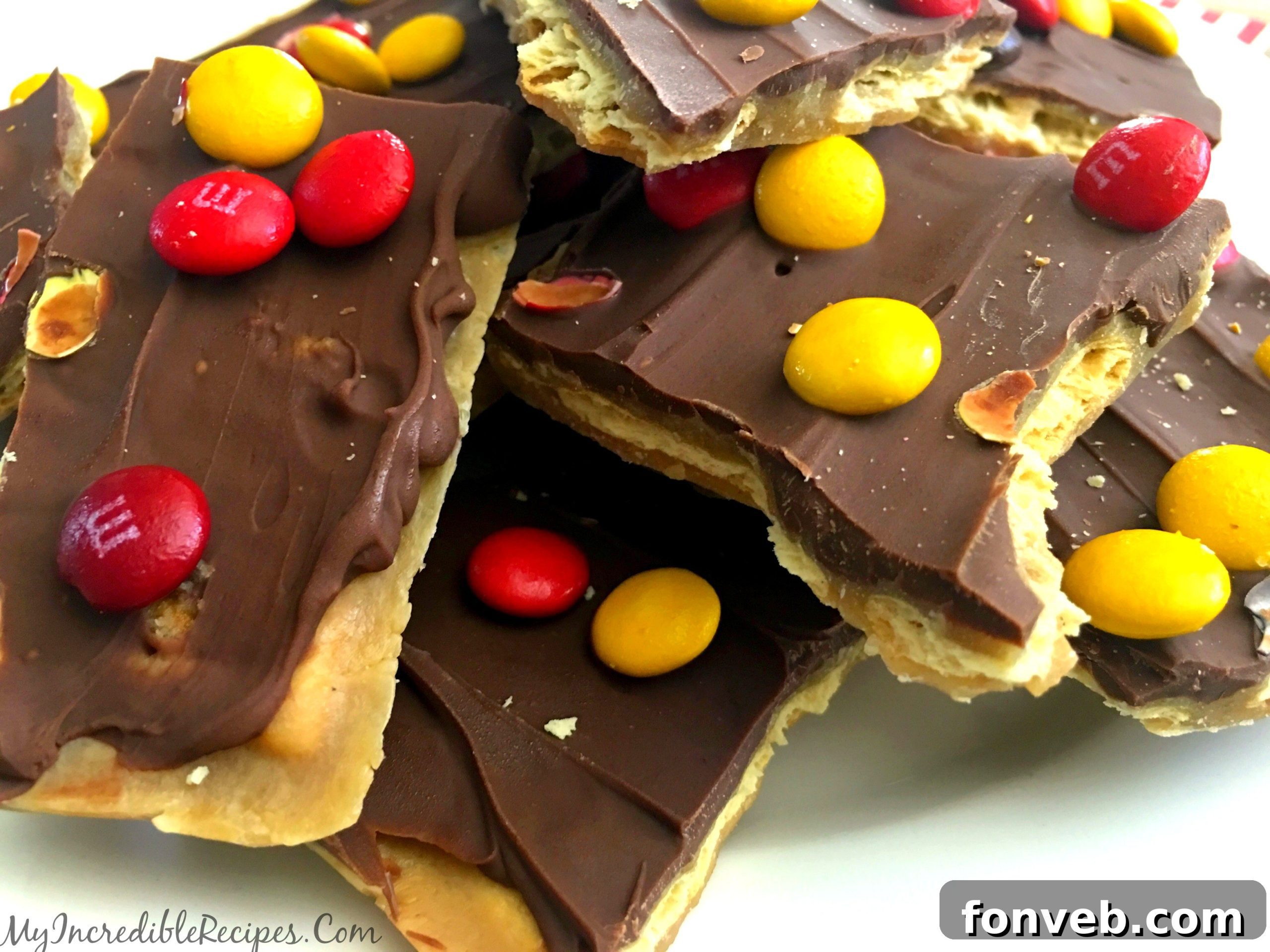 Pieces of saltine cracker toffee arranged neatly on a serving tray