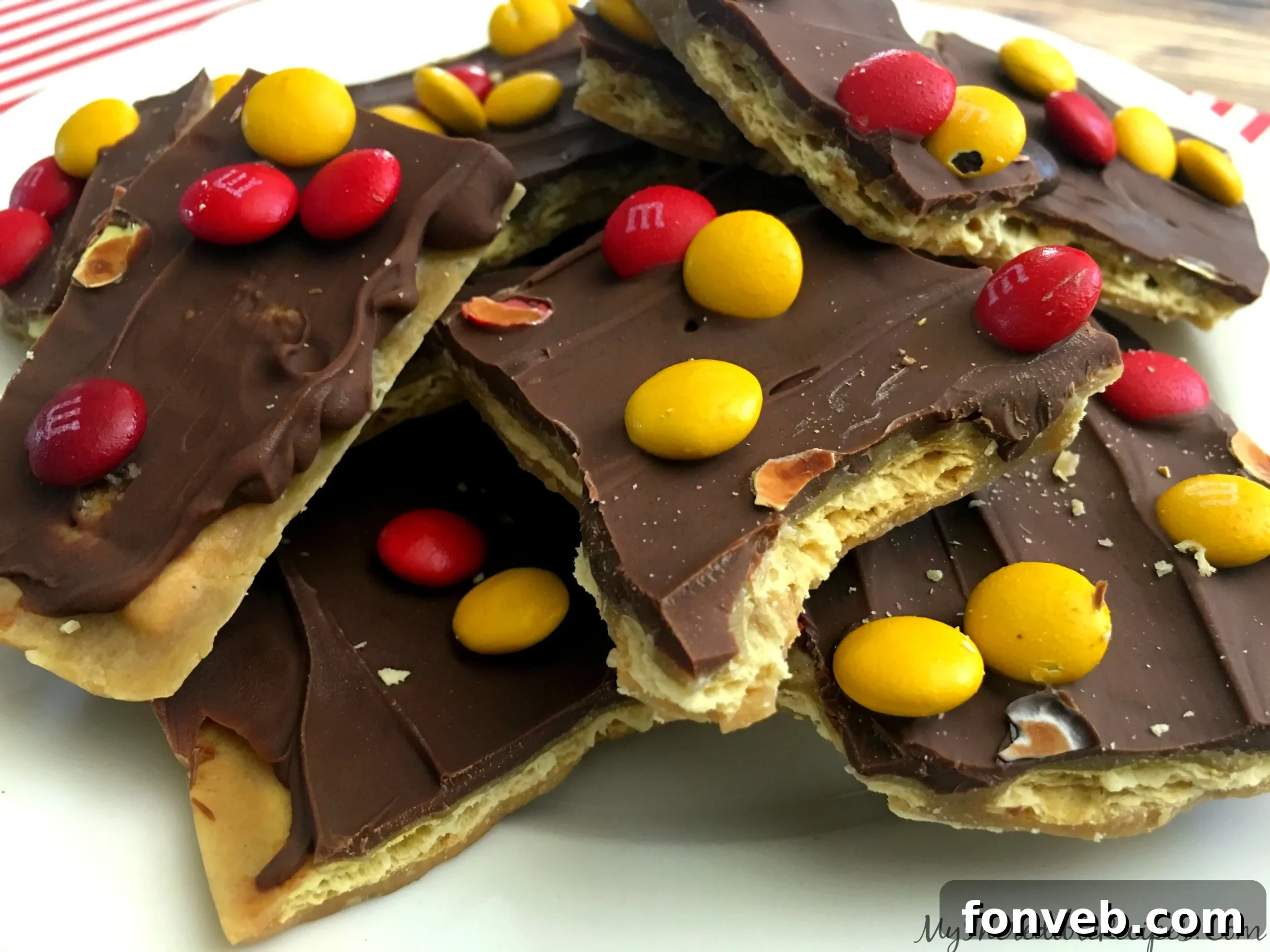 Gift-wrapped pieces of saltine cracker toffee, tied with a bow, perfect for sharing