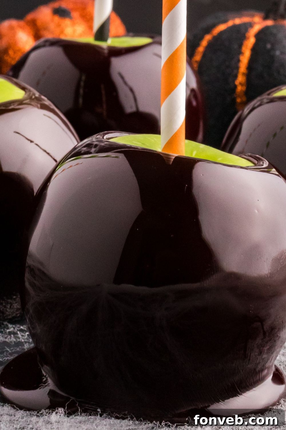 close up of black candy apple