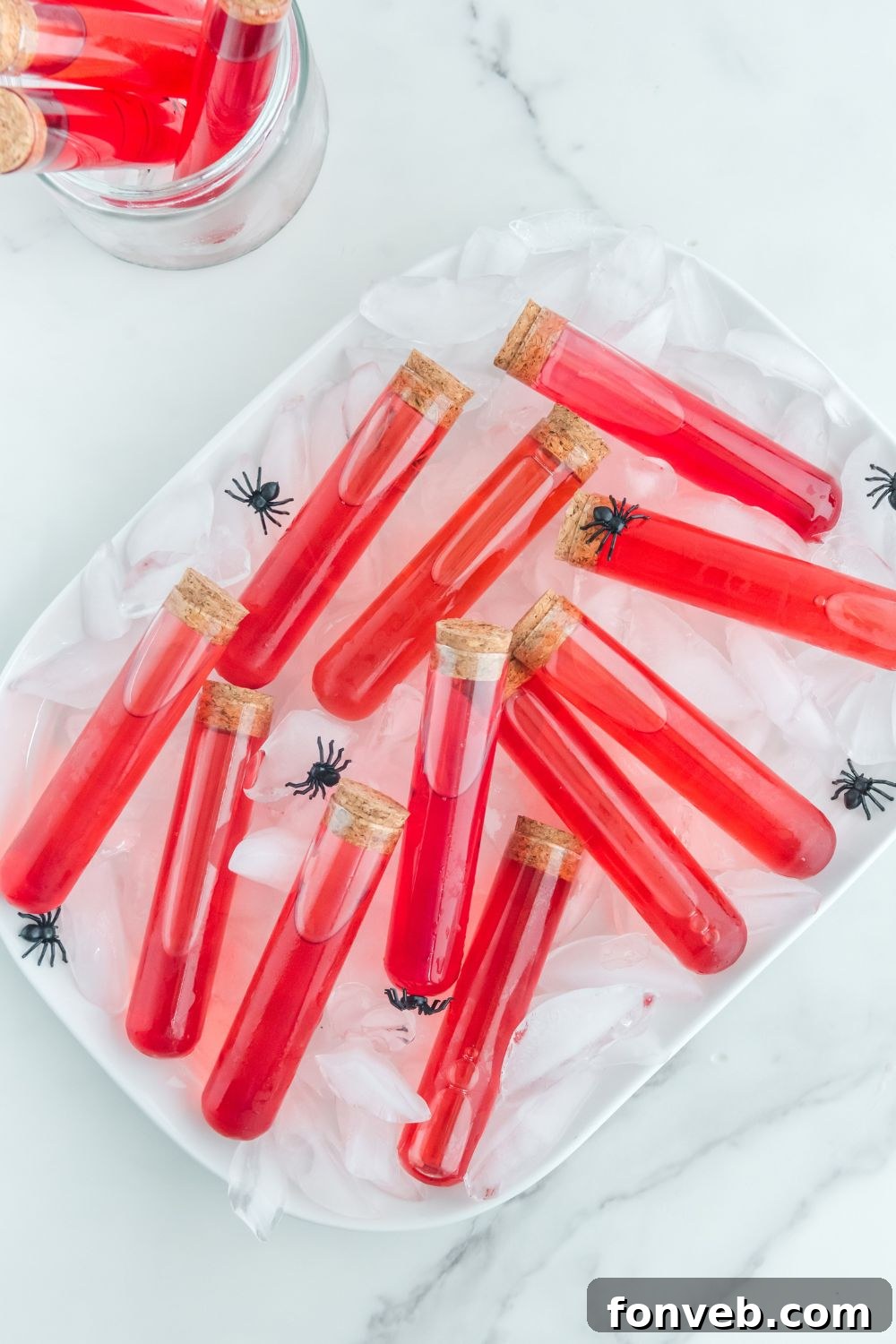 halloween shots in test tubes on the table with ice on a tray to keep cold